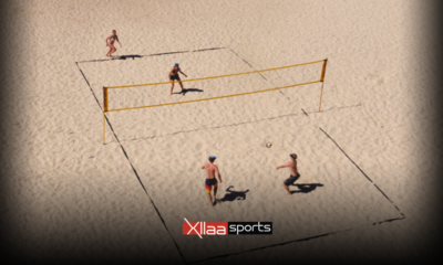 In what ways do indoor volleyball and beach volleyball differ?